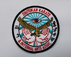 Embroidery badge with metal thread